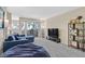 Well-lit living room with modern furnishings, and a sliding glass door to an outdoor area at 668 Oakmont Ave # 1724, Las Vegas, NV 89109