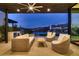 Cozy outdoor living space with comfortable seating, built-in grill, and scenic views at 678 Blackrock Rim Dr, Henderson, NV 89012