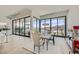 Bright dining area featuring an elegant chandelier, neutral decor and mountain views at 678 Blackrock Rim Dr, Henderson, NV 89012