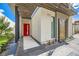 Modern home showcasing a red front door, decorative screen, and contemporary design elements at 678 Blackrock Rim Dr, Henderson, NV 89012