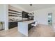 Modern kitchen with island, breakfast bar, and open shelving with white subway tile at 678 Blackrock Rim Dr, Henderson, NV 89012