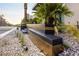 Modern desert landscaping with a block wall, gravel, and desert plants at 678 Blackrock Rim Dr, Henderson, NV 89012