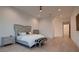 Bright bedroom with light wood floors, featuring recessed lighting and contemporary furnishings at 678 Blackrock Rim Dr, Henderson, NV 89012