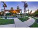 Backyard featuring a modern pool, spa and lounge chairs with the house reflecting in the foreground at 678 Blackrock Rim Dr, Henderson, NV 89012