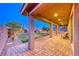 Covered backyard patio with a beautiful stone paver floor at 7106 Stanley Frederick St, Las Vegas, NV 89166