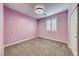 Cozy carpeted bedroom features neutral tones and a bright window at 7106 Stanley Frederick St, Las Vegas, NV 89166