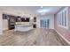 Elegant kitchen featuring dark cabinetry, granite countertops, and modern appliances at 7106 Stanley Frederick St, Las Vegas, NV 89166