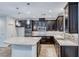 Gourmet kitchen featuring a center island, granite countertops, and stainless steel appliances at 7106 Stanley Frederick St, Las Vegas, NV 89166