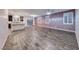 Spacious living area featuring modern tile flooring, shutters, and a chandelier at 7106 Stanley Frederick St, Las Vegas, NV 89166