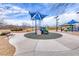 Community playground with play equipment and picnic tables for Gathering fun and neighborhood gatherings at 7106 Stanley Frederick St, Las Vegas, NV 89166