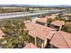 High-angle view of residential buildings near a highway, blending urban accessibility with community living at 7300 Pirates Cove Rd # 1062, Las Vegas, NV 89145