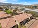 View of the community near a highway, featuring well-maintained apartment buildings and surroundings at 7300 Pirates Cove Rd # 1062, Las Vegas, NV 89145