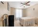 Bedroom featuring neutral tones, ceiling fan and furniture at 7300 Pirates Cove Rd # 1062, Las Vegas, NV 89145