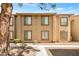 Inviting condo building with well-maintained landscaping and neutral color palette at 7300 Pirates Cove Rd # 1062, Las Vegas, NV 89145