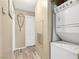 Hallway featuring a laundry area with stacked washer and dryer at 7300 Pirates Cove Rd # 1062, Las Vegas, NV 89145