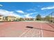 Community tennis court under a blue sky, offering recreational opportunities for residents at 7300 Pirates Cove Rd # 1062, Las Vegas, NV 89145