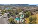 Scenic aerial shot of property with terra cotta roofs near a pool area and lush green landscape at 75 Luce Del Sole # 3, Henderson, NV 89011