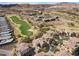 Picturesque aerial view presenting homes adjacent to a golf course set against mountain scenery at 75 Luce Del Sole # 3, Henderson, NV 89011