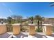 Inviting balcony offers a tranquil outdoor escape with scenic views of lush landscaping and sunny skies at 75 Luce Del Sole # 3, Henderson, NV 89011