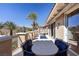 Relaxing outdoor balcony features comfortable seating and stunning neighborhood views under sunny skies at 75 Luce Del Sole # 3, Henderson, NV 89011