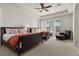 Bright bedroom with two beds, carpeted floor, ceiling fan, and shuttered windows at 75 Luce Del Sole # 3, Henderson, NV 89011