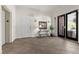 Foyer with decorative table, wall sconces, and tiled floor at 75 Luce Del Sole # 3, Henderson, NV 89011