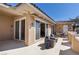 A lovely, well lit patio with comfortable seating, several glass doors, and a tiled roof at 75 Luce Del Sole # 3, Henderson, NV 89011