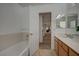 Bright bathroom with a tub, shower, and vanity, providing a functional space at 7650 Hartwell Dr, Las Vegas, NV 89123