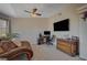 Bedroom includes a lounge area with a chaise, a desk area, and a large wall-mounted television at 7650 Hartwell Dr, Las Vegas, NV 89123