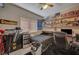 A bedroom with shelves displaying collectibles and a dark-colored bed at 7650 Hartwell Dr, Las Vegas, NV 89123