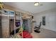 Bedroom featuring a loft bed, carpet, window with blinds, and storage at 7650 Hartwell Dr, Las Vegas, NV 89123