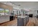 Sunlit kitchen offers modern appliances and views into the dining and living areas at 7650 Hartwell Dr, Las Vegas, NV 89123