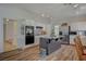 Well-lit kitchen boasting white cabinetry, stainless steel appliances, and wood-look flooring at 7650 Hartwell Dr, Las Vegas, NV 89123