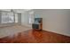 Bright living room featuring laminate flooring, a ceiling fan, and large windows at 7650 Hartwell Dr, Las Vegas, NV 89123