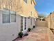 Cozy backyard space with neutral stucco wall and a paver patio, ideal for outdoor relaxation at 7752 Orchard Wood Ct, Las Vegas, NV 89131