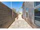 This backyard features a block wall, a patio, and stucco exterior, ideal for relaxation at 7752 Orchard Wood Ct, Las Vegas, NV 89131