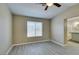 Inviting bedroom with gray wood-like flooring and ensuite bathroom access at 7752 Orchard Wood Ct, Las Vegas, NV 89131