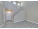 Welcoming entryway with stairs, modern flooring, and a bright white front door at 7752 Orchard Wood Ct, Las Vegas, NV 89131