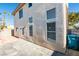 Home exterior with a patio, stucco wall, and desert landscaping, emphasizing a private outdoor space at 7752 Orchard Wood Ct, Las Vegas, NV 89131