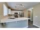 Modern kitchen with stainless appliances, stone countertops, and ample cabinet space at 7752 Orchard Wood Ct, Las Vegas, NV 89131