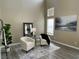 Bright living room featuring high ceilings, neutral walls, luxury vinyl plank flooring, and elegant decor at 7752 Orchard Wood Ct, Las Vegas, NV 89131