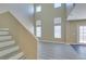 Bright living room featuring high ceilings, neutral walls, luxury vinyl plank flooring, and elegant decor at 7752 Orchard Wood Ct, Las Vegas, NV 89131