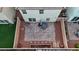 Aerial view of backyard featuring a brick patio, seating, and desert landscaping at 7970 Calito St, Las Vegas, NV 89166