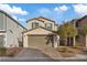 Charming two-story home boasts a paved driveway, well-manicured landscaping, and a welcoming facade, blending comfort and style at 7970 Calito St, Las Vegas, NV 89166