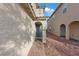 Inviting entryway with a teal door, brick pathway, and decorative wall accent at 7970 Calito St, Las Vegas, NV 89166