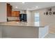 Spacious kitchen featuring wood cabinets, granite countertops, and ample counter space at 7970 Calito St, Las Vegas, NV 89166