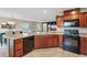 Modern kitchen featuring granite countertops, stainless steel appliances, and ample cabinet space at 7970 Calito St, Las Vegas, NV 89166