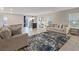 Bright and airy living room with tile flooring, comfortable seating, and an open layout at 7970 Calito St, Las Vegas, NV 89166