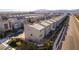 Overhead view of modern homes in a tidy community; note landscaping and views at 8012 Carpenter Creek Ave, Las Vegas, NV 89113