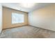 Neutral bedroom with carpet flooring and large windows at 8012 Carpenter Creek Ave, Las Vegas, NV 89113